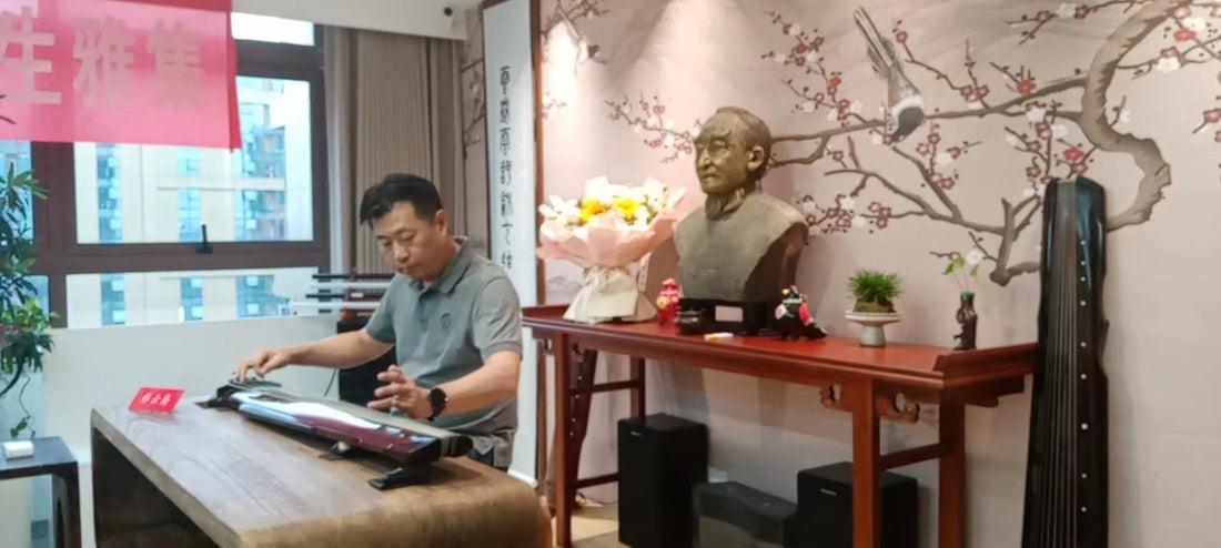 "A guqin player performs beside a bronze bust of master Mei Yueqiang, with a plum blossom mural and a second guqin in the background — the living tradition of oral transmission in guqin music"