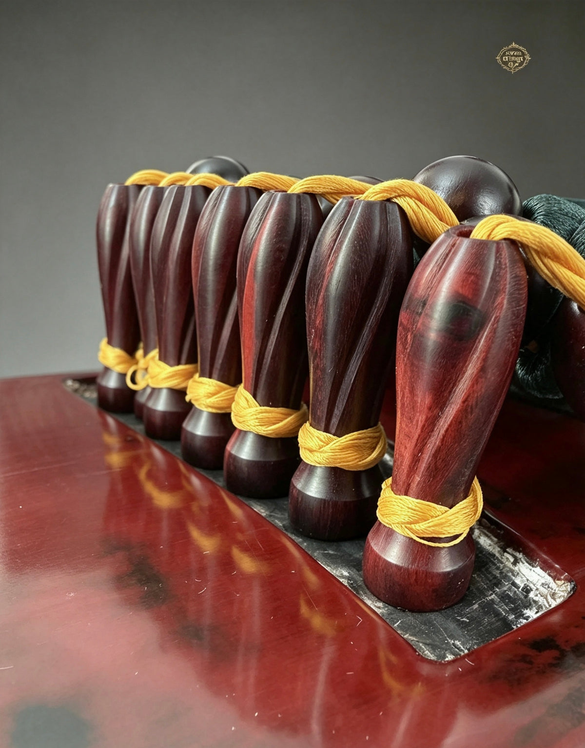 Banana Leaf guqin – seven tuning pegs with gold silk ties, close-up