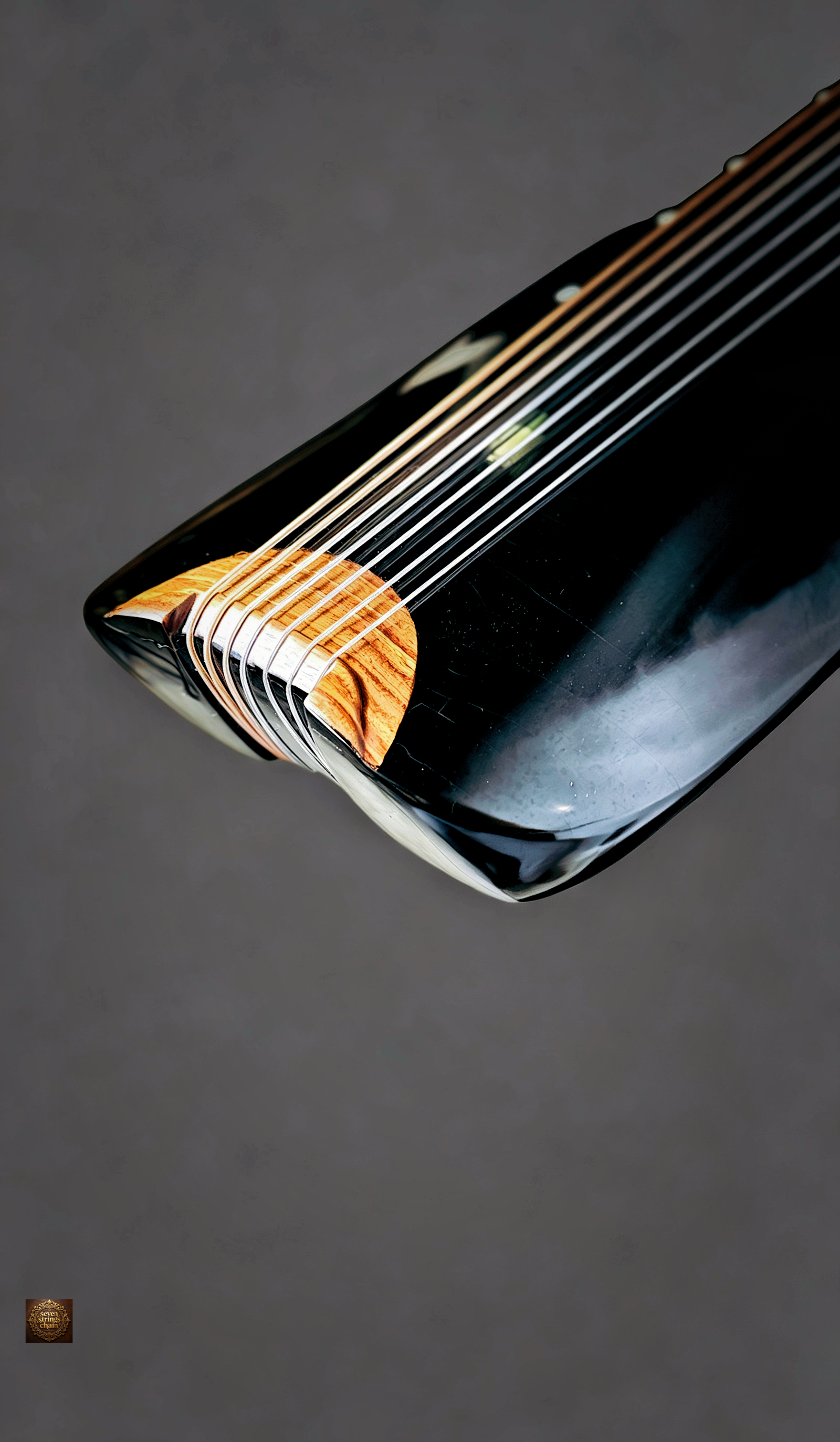 Jiaolin Tingyu Guqin – close-up of upper body with seven strings running across soundboard